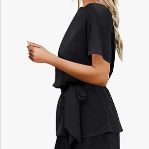 Cute black romper with open back.